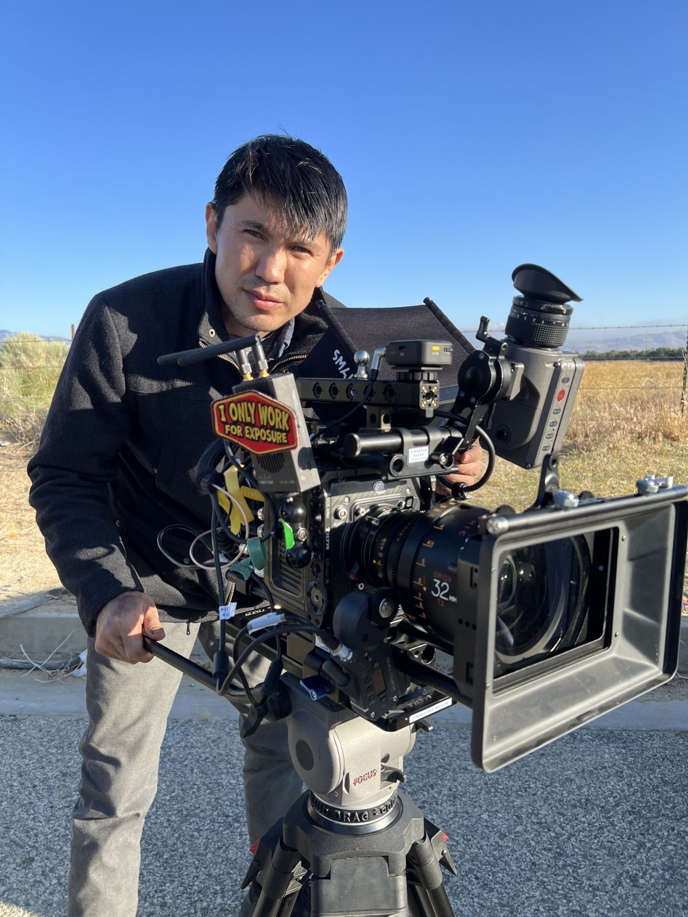 Medet Aman behind a cinema camera on set, photo 4